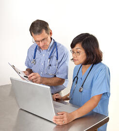Doctor And Nurse Reviewing Patient Information